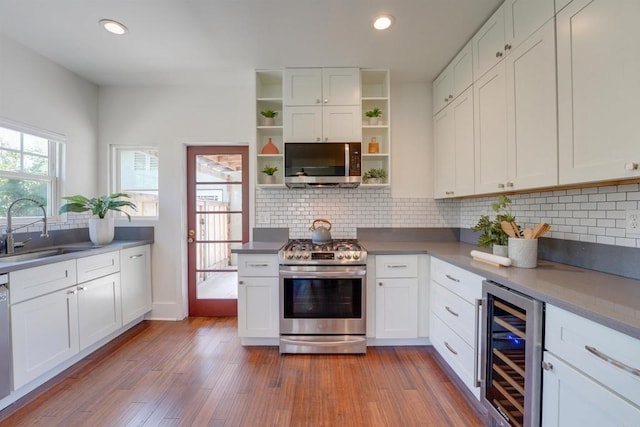 487678 34th St, San Diego, CA 92116 - kitchen featuring beverage cooler, appliances with stainless steel finishes, open shelves, white cabinetry, and recessed lighting
