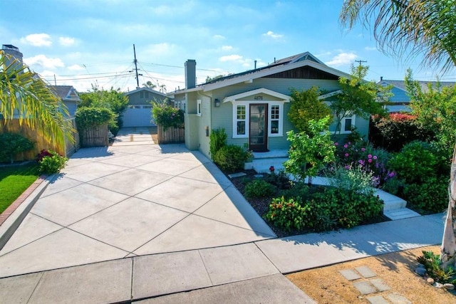 487678 34th St, San Diego, CA 92116 - bungalow-style home with a chimney, an outdoor structure, and concrete driveway