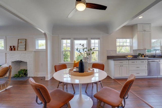 487678 34th St, San Diego, CA 92116 - dining area with ceiling fan, dark wood-type flooring, a fireplace, and recessed lighting