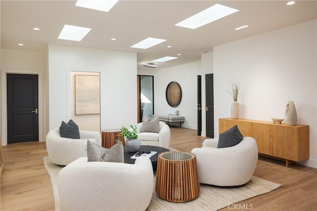 23262 Ellice Cir, Dana Point, CA 92629 - living room featuring a skylight, light wood-style floors, and recessed lighting