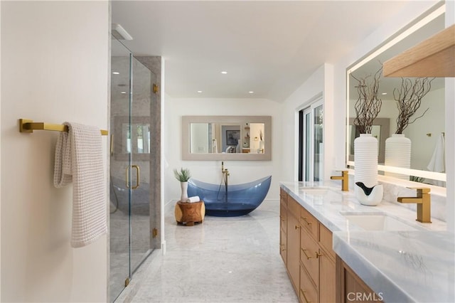 23262 Ellice Cir, Dana Point, CA 92629 - full bathroom with a stall shower, double vanity, and a soaking tub
