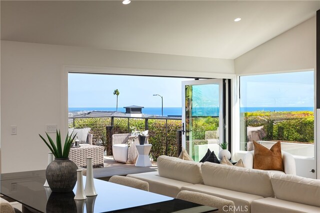 23262 Ellice Cir, Dana Point, CA 92629 - living room featuring a water view, lofted ceiling, and recessed lighting
