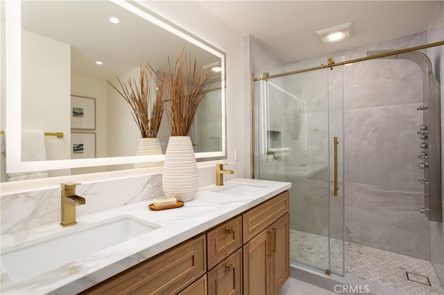 23262 Ellice Cir, Dana Point, CA 92629 - bathroom featuring double vanity, a marble finish shower, and recessed lighting