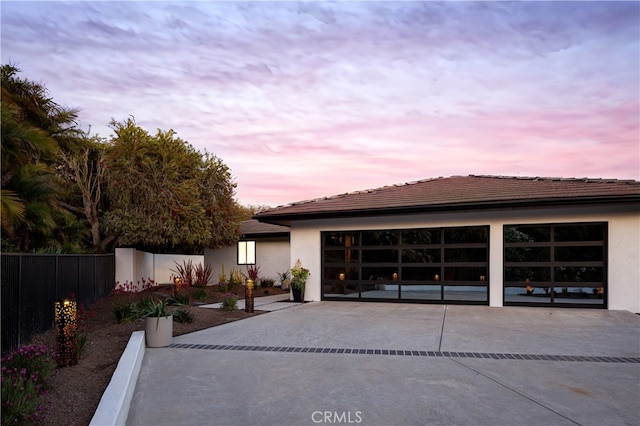 23262 Ellice Cir, Dana Point, CA 92629 - view of front of home with driveway, fence, an attached garage, and stucco siding