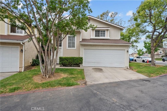 11483 Green Vly, Pacoima, CA 91331 - view of front of property with stucco siding, a garage, and driveway