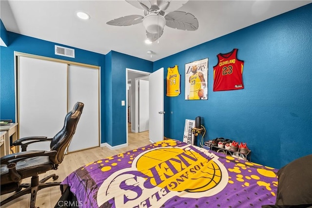 11483 Green Vly, Pacoima, CA 91331 - bedroom featuring light wood-style floors, a closet, ceiling fan, an office area, and baseboards