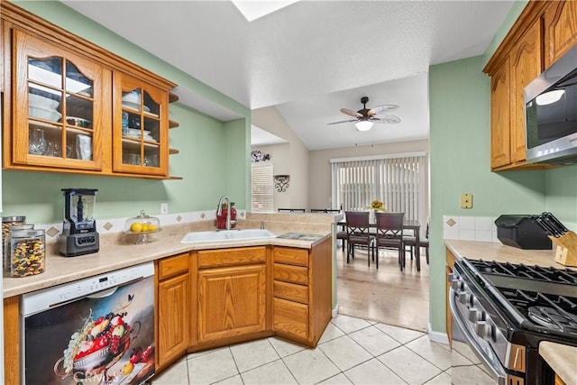 11483 Green Vly, Pacoima, CA 91331 - kitchen with appliances with stainless steel finishes, a sink, light countertops, a ceiling fan, and a peninsula