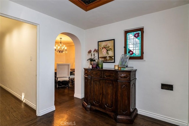 1731 W Kenneth Rd, Glendale, CA 91201 - corridor featuring arched walkways, a chandelier, dark wood-style floors, and baseboards