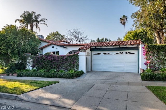 1731 W Kenneth Rd, Glendale, CA 91201 - mediterranean / spanish home featuring a tile roof, stucco siding, and driveway