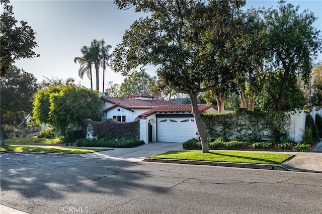 1731 W Kenneth Rd, Glendale, CA 91201 - mediterranean / spanish home with a tile roof, a garage, concrete driveway, and stucco siding