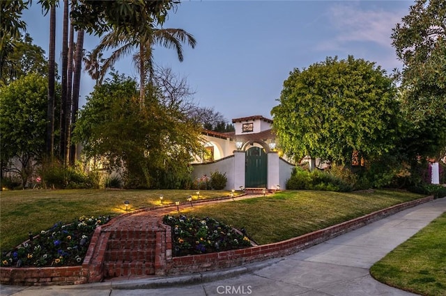 1731 W Kenneth Rd, Glendale, CA 91201 - view of front of house featuring a front yard and stucco siding