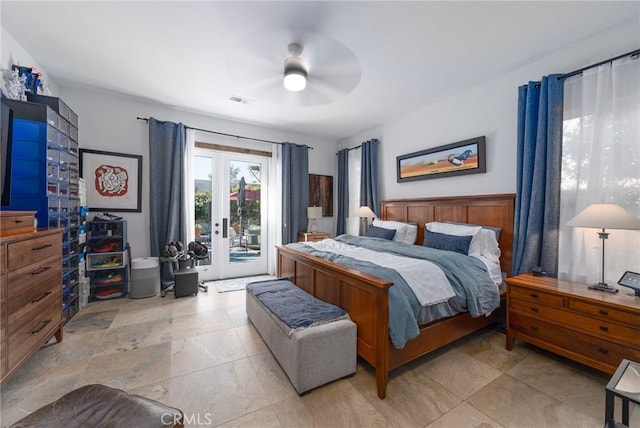 bedroom with access to outside, french doors, light stone finish flooring, and a ceiling fan