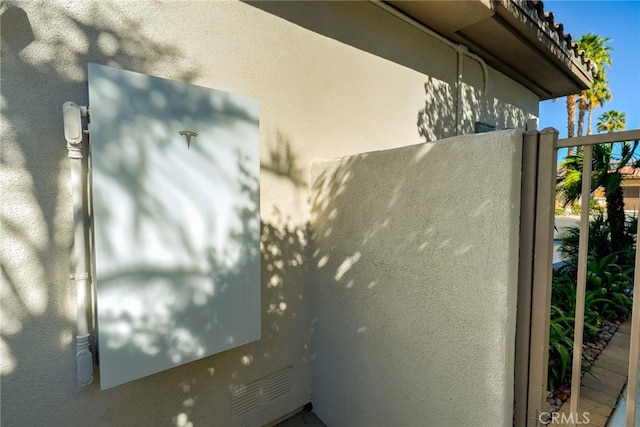 view of side of home featuring stucco siding