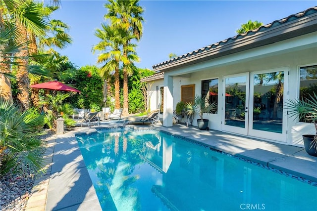 9 Via Dulcinea, Dulcinea, Palm Desert, CA 92260 - swimming pool with a patio area and french doors