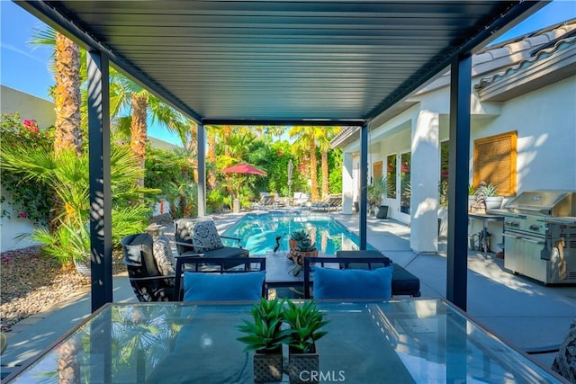 9 Via Dulcinea, Dulcinea, Palm Desert, CA 92260 - view of patio / terrace with area for grilling, an outdoor pool, and outdoor dining space
