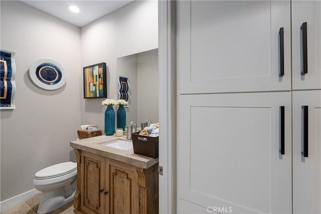 9 Via Dulcinea, Dulcinea, Palm Desert, CA 92260 - half bathroom featuring vanity, toilet, baseboards, tile patterned floors, and recessed lighting