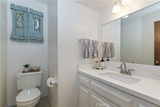1027 Nesthorn Dr, Crestline, CA 92325 - bathroom featuring toilet, vanity, and baseboards
