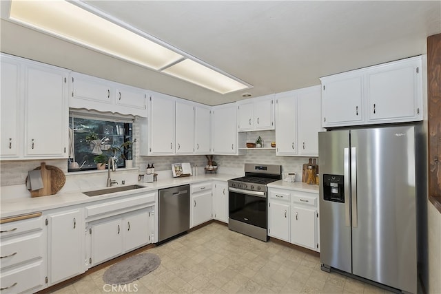 1027 Nesthorn Dr, Crestline, CA 92325 - kitchen with stainless steel appliances, a sink, backsplash, and white cabinets
