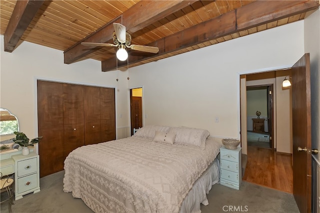 1027 Nesthorn Dr, Crestline, CA 92325 - bedroom featuring wooden ceiling, beamed ceiling, a closet, ceiling fan, and wood finished floors