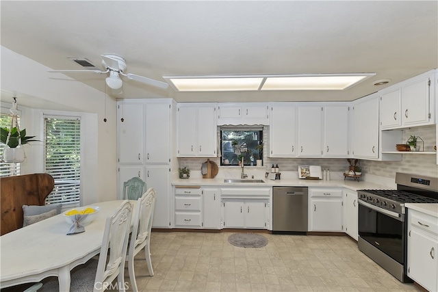 1027 Nesthorn Dr, Crestline, CA 92325 - kitchen featuring stainless steel appliances, a sink, light countertops, and tasteful backsplash