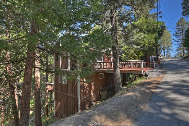 1027 Nesthorn Dr, Crestline, CA 92325 - view of property exterior with a deck and central air condition unit