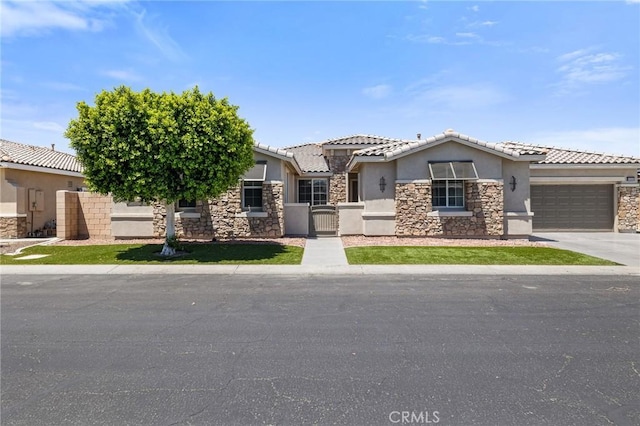 view of front of home featuring stone siding, stucco siding, a tile roof, concrete driveway, and an attached garage