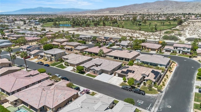 view of property location with nearby suburban area and a water and mountain view