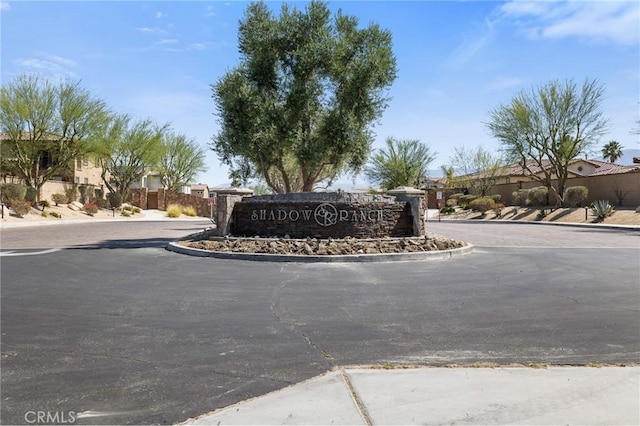 community / neighborhood sign featuring a residential view