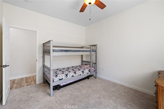 bedroom with carpet flooring, baseboards, and a ceiling fan