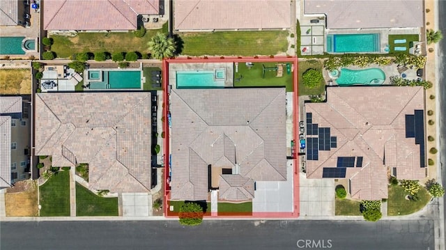aerial overview of property's location with a pool and property boundaries highlighted
