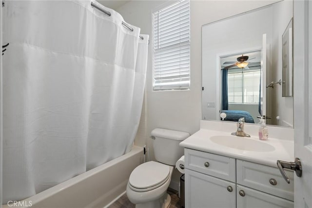 full bathroom featuring shower / tub combo with curtain, vanity, toilet, and ensuite bathroom