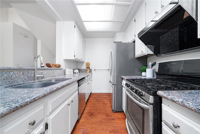 1188 Walnut Grove Ave Unit A, Rosemead, CA 91770 - kitchen with stainless steel appliances, a sink, wood finished floors, white cabinets, and light stone countertops