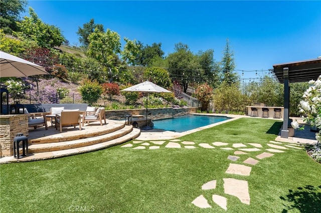 view of swimming pool with a patio area, a yard, and an outdoor hangout area