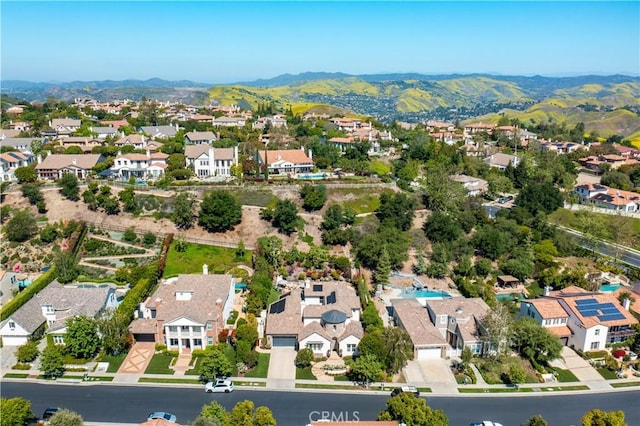 aerial perspective of suburban area featuring a mountainous background