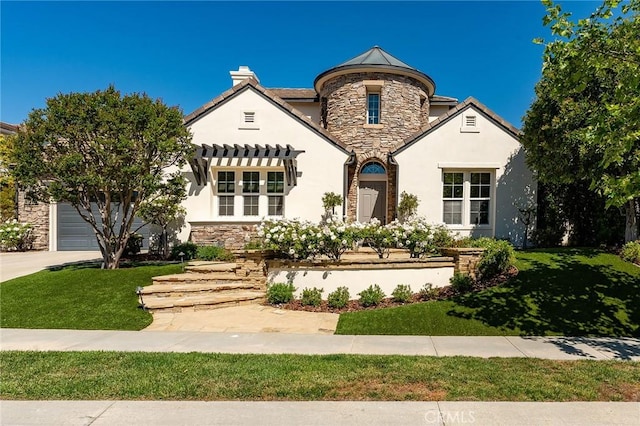 french provincial home featuring stone siding, stucco siding, and a front lawn