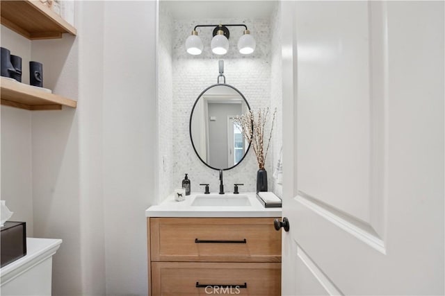 half bath featuring vanity