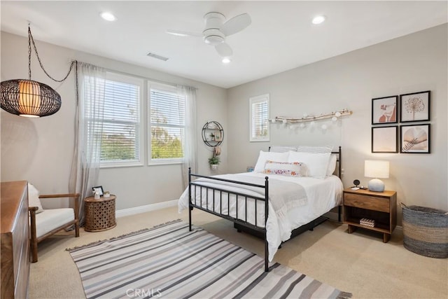 bedroom featuring light carpet, recessed lighting, a ceiling fan, and baseboards