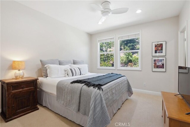 bedroom with light colored carpet, baseboards, ceiling fan, and recessed lighting