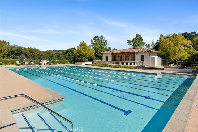 community pool featuring fence