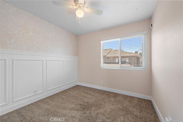 26932 Begonia Pl, Mission Viejo, CA 92692 - unfurnished room featuring wainscoting, carpet floors, a ceiling fan, a decorative wall, and wallpapered walls