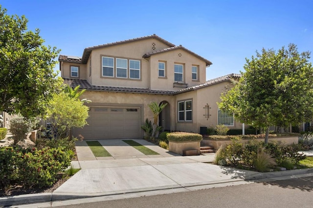 1797 Santa Christina Ave, Chula Vista, CA 91913 - mediterranean / spanish-style home featuring driveway, an attached garage, a tiled roof, and stucco siding