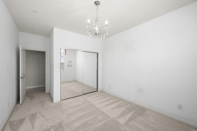 1797 Santa Christina Ave, Chula Vista, CA 91913 - unfurnished bedroom with a chandelier, light carpet, and a closet