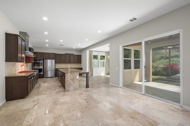 1797 Santa Christina Ave, Chula Vista, CA 91913 - kitchen featuring appliances with stainless steel finishes, decorative backsplash, light stone counters, stone tile flooring, and recessed lighting