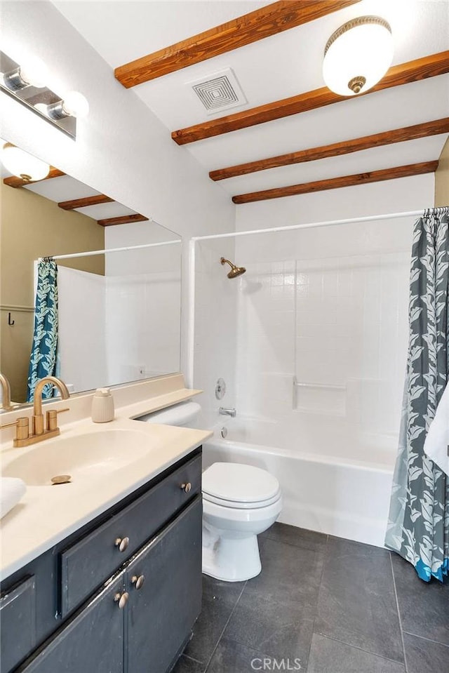 bathroom with tile patterned floors, toilet, vanity, and shower / tub combo with curtain