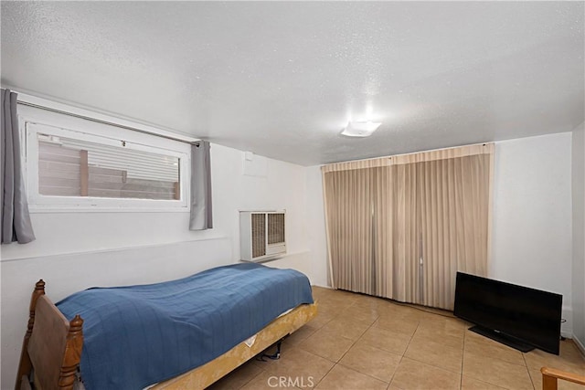 521 S Francisca Ave, Redondo Beach, CA 90277 - bedroom with light tile patterned floors, a textured ceiling, and heating unit