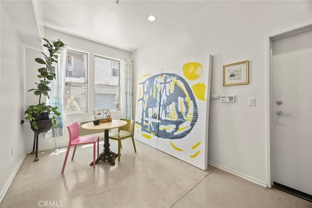 253 N Bush St, Santa Ana, CA 92701 - dining space featuring baseboards and concrete flooring