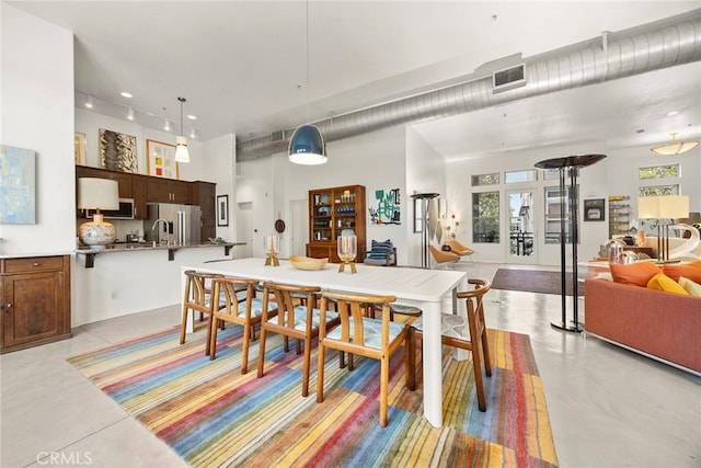 253 N Bush St, Santa Ana, CA 92701 - dining space featuring concrete flooring