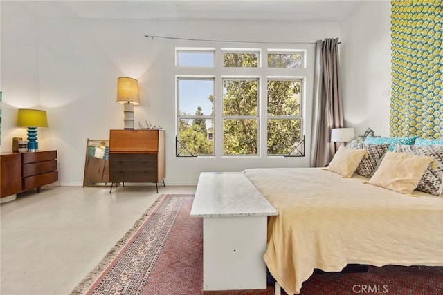 253 N Bush St, Santa Ana, CA 92701 - bedroom with concrete flooring and baseboards