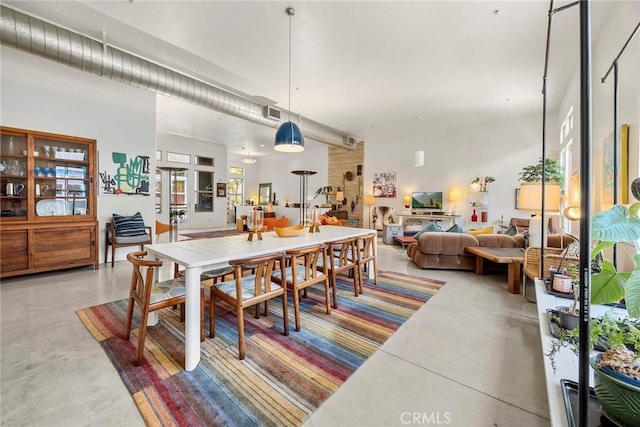253 N Bush St, Santa Ana, CA 92701 - dining area featuring finished concrete flooring