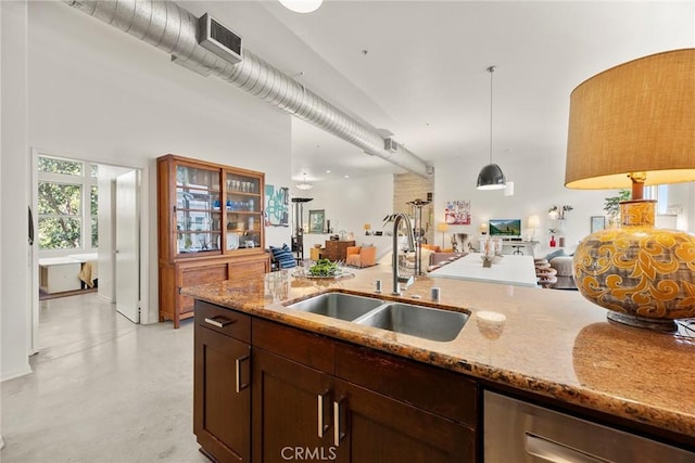 253 N Bush St, Santa Ana, CA 92701 - kitchen featuring open floor plan, light stone countertops, finished concrete flooring, pendant lighting, and stainless steel dishwasher